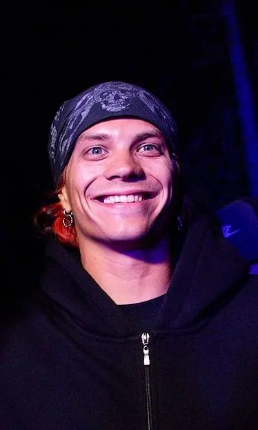 Ilia Baskakov smiling in a bandana